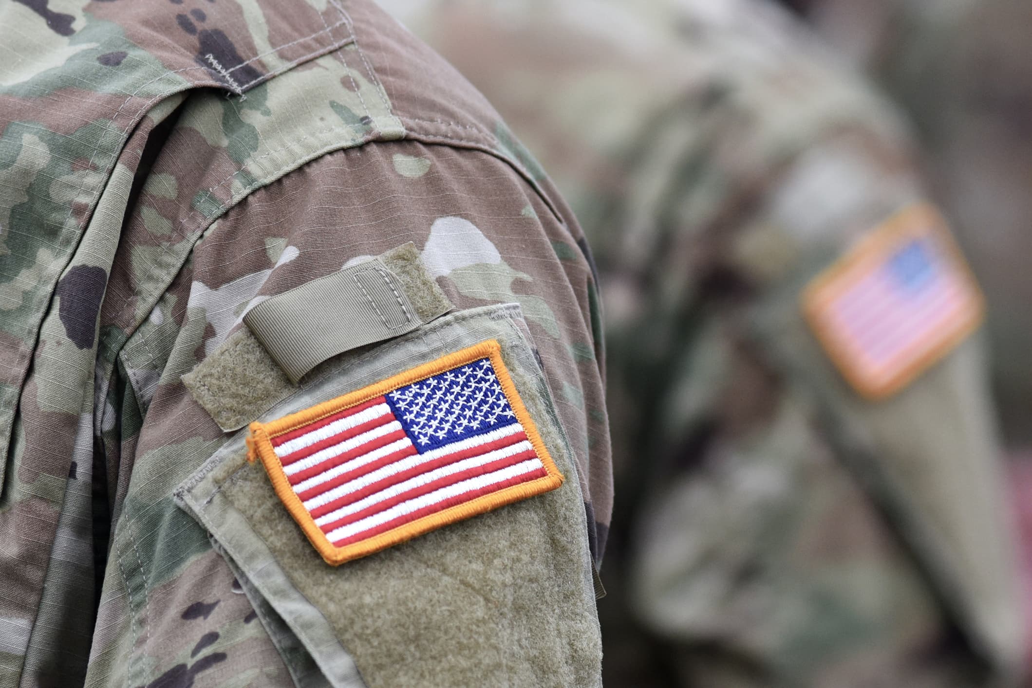 U.S. flag patch on the uniform of an American soldier — treatment for veterans at Renaissance Ranch